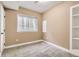 Neutral bedroom featuring cozy carpet floors, a built in shelf and plenty of natural light at 736 Trenton St, Denver, CO 80230