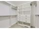 Walk-in closet featuring shelving, drawers, and ample storage space for clothes and accessories at 736 Trenton St, Denver, CO 80230