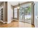 Bright dining area with hardwood floors, sliding glass doors and backyard view at 736 Trenton St, Denver, CO 80230