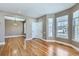 Spacious living room with hardwood floors, large windows, and a view of the surrounding neighborhood at 736 Trenton St, Denver, CO 80230