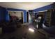 Bedroom with blue walls, patterned carpet, and furniture at 10211 Ura Ln # 5-206, Thornton, CO 80260