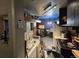 View of the kitchen with a sink and view of a room at 10211 Ura Ln # 5-206, Thornton, CO 80260