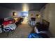 Spacious living room featuring carpet floors and basic furniture at 10211 Ura Ln # 5-206, Thornton, CO 80260