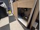 Exposed undersink area with black and white checkered flooring at 10211 Ura Ln # 5-206, Thornton, CO 80260