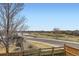 Scenic view of the backyard, golf course, pond, and surrounding community at 6302 E 135Th Ave, Thornton, CO 80602