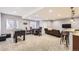 Finished basement with a seating area, foosball table, and kitchenette bar, great for entertaining guests at 6302 E 135Th Ave, Thornton, CO 80602