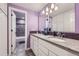Stylish bathroom with a double vanity, granite countertop, and tiled shower-tub combination at 6302 E 135Th Ave, Thornton, CO 80602