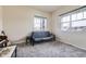 Bedroom with futon and windows at 6302 E 135Th Ave, Thornton, CO 80602