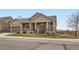 Beautiful exterior of a home featuring a stone facade and a charming front porch at 6302 E 135Th Ave, Thornton, CO 80602