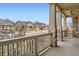 Cozy front porch with stone pillars, seating, and views of the neighborhood street at 6302 E 135Th Ave, Thornton, CO 80602