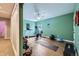 Home gym with a treadmill, exercise bike, and free weights to support your fitness goals at 6302 E 135Th Ave, Thornton, CO 80602
