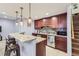 Well-equipped kitchenette with granite countertops, stainless steel appliances, and bar seating at 6302 E 135Th Ave, Thornton, CO 80602