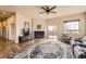Spacious living room featuring a fireplace, large rug, and ample natural light at 6302 E 135Th Ave, Thornton, CO 80602