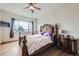 Spacious main bedroom with a ceiling fan, wood floors and an outside view at 6302 E 135Th Ave, Thornton, CO 80602