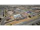 Aerial view of commercial district with many parking spaces and surrounding streets and neighborhoods at 3656 E 134Th Dr, Thornton, CO 80241
