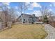 An expansive backyard has a patio, tall trees, mature landscaping, and privacy fence at 3656 E 134Th Dr, Thornton, CO 80241