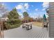 Backyard with a wood deck and outdoor dining set perfect for entertaining friends at 3656 E 134Th Dr, Thornton, CO 80241