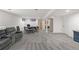 Open basement with living and game area, neutral carpeting, and white-painted walls at 3656 E 134Th Dr, Thornton, CO 80241