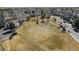 Community pool with a pool, seating, shade, a playground, and green space at 3656 E 134Th Dr, Thornton, CO 80241