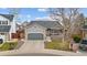 Charming home with a two-car garage, covered porch, and well-maintained front yard at 3656 E 134Th Dr, Thornton, CO 80241