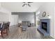 Cozy living room with a fireplace, comfortable seating, and natural light at 3656 E 134Th Dr, Thornton, CO 80241