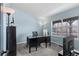 Comfortable office space with a large window and neutral carpet at 3656 E 134Th Dr, Thornton, CO 80241