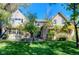 Well-maintained home with a sprawling lawn, mature trees, and an inviting backyard patio at 3737 26Th St, Boulder, CO 80304