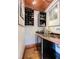 This bar area features wine racks, a beverage fridge, and artistic decor at 3737 26Th St, Boulder, CO 80304