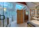 Bright bathroom with a skylight, dual sinks, and a glass-enclosed shower at 3737 26Th St, Boulder, CO 80304
