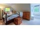 Charming bedroom featuring sloped ceilings, a decorative bed frame, and a window seat at 3737 26Th St, Boulder, CO 80304
