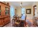 This dining room features a chandelier, large windows, and an antique cabinet at 3737 26Th St, Boulder, CO 80304