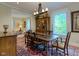 This dining room features a chandelier, large windows, and an antique cabinet at 3737 26Th St, Boulder, CO 80304