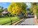 The home's exterior is complemented by mature trees and a long driveway leading to a detached garage at 3737 26Th St, Boulder, CO 80304