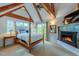 Cozy main bedroom with wooden beams, a fireplace, and a four-poster bed at 3737 26Th St, Boulder, CO 80304
