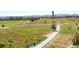 Scenic community park with walking path, lush greenery and seating at 8336 E 35Th Ave, Denver, CO 80238