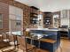 Modern kitchen area with stainless steel sink, open shelving and adjacent dining area at 8336 E 35Th Ave, Denver, CO 80238