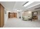 Finished basement offering flexible living space with carpeted floors and recessed lighting at 8205 Dudley Way, Arvada, CO 80005