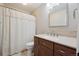 Bathroom vanity with stylish fixtures and shower with curtain at 8205 Dudley Way, Arvada, CO 80005