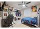 Bedroom with ceiling fan, shelving, and closet at 8205 Dudley Way, Arvada, CO 80005