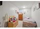 Bedroom with carpeted floors and toy storage at 8205 Dudley Way, Arvada, CO 80005