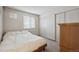 Bedroom with natural light, large closet, and dresser at 8205 Dudley Way, Arvada, CO 80005