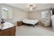 Cozy bedroom with carpet flooring, natural light, and classic furniture at 8205 Dudley Way, Arvada, CO 80005