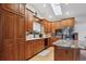 Modern kitchen featuring wood cabinets, stainless steel appliances, and granite countertops at 8205 Dudley Way, Arvada, CO 80005