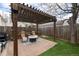 Charming backyard patio with a pergola, string lights, a gas grill, and cozy seating at 3220 W 24Th Ave, Denver, CO 80211