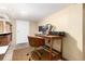 Basement office with a wooden desk, computer and comfortable chair at 3220 W 24Th Ave, Denver, CO 80211