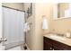 Clean, well-lit bathroom featuring a shower-tub combo and modern vanity with stylish fixtures at 3220 W 24Th Ave, Denver, CO 80211