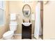 Bathroom featuring an oval mirror, single sink vanity and shower with white curtain at 3220 W 24Th Ave, Denver, CO 80211