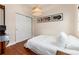 Bedroom with closet, hardwood floors, record art, and natural light at 3220 W 24Th Ave, Denver, CO 80211
