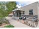 Charming home featuring a covered porch, stone accents, and a cozy seating area at 3220 W 24Th Ave, Denver, CO 80211