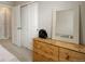Bedroom featuring a large closet, dresser, and mirror offering storage and style in a comfortable setting at 9279 Merino Ct # D, Littleton, CO 80125